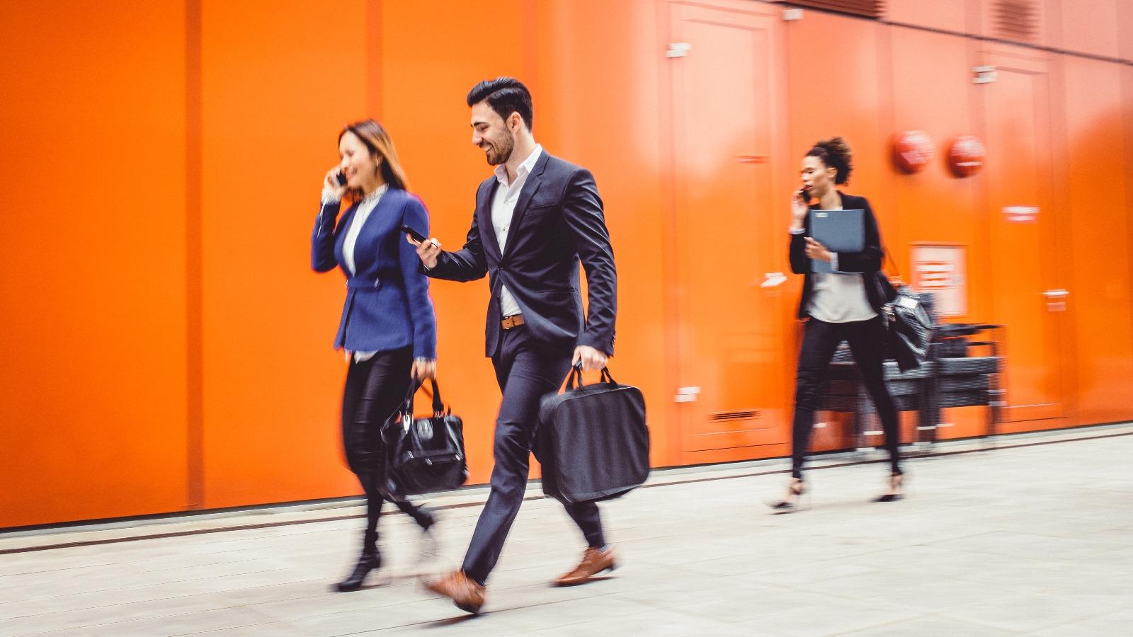 People walking on street in suits