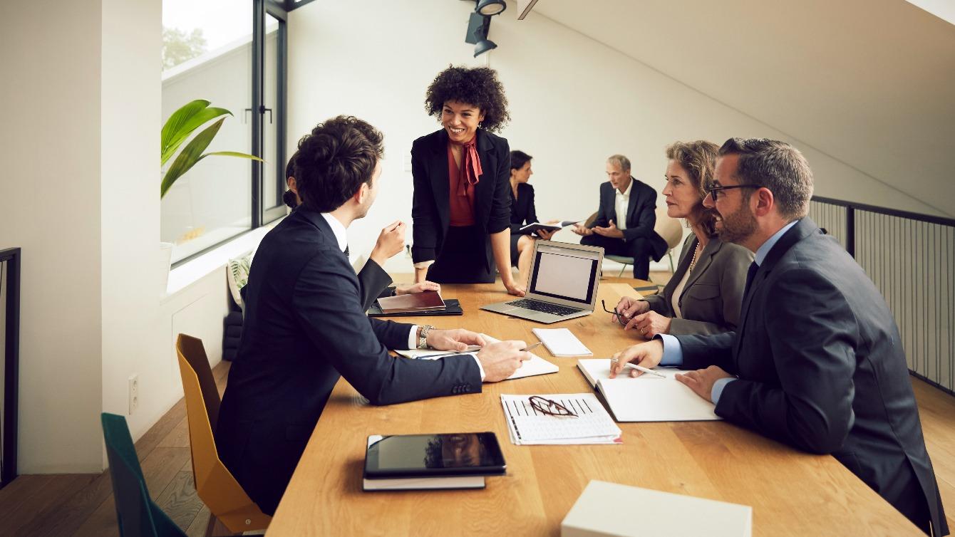 Woman speaking at a business meeting