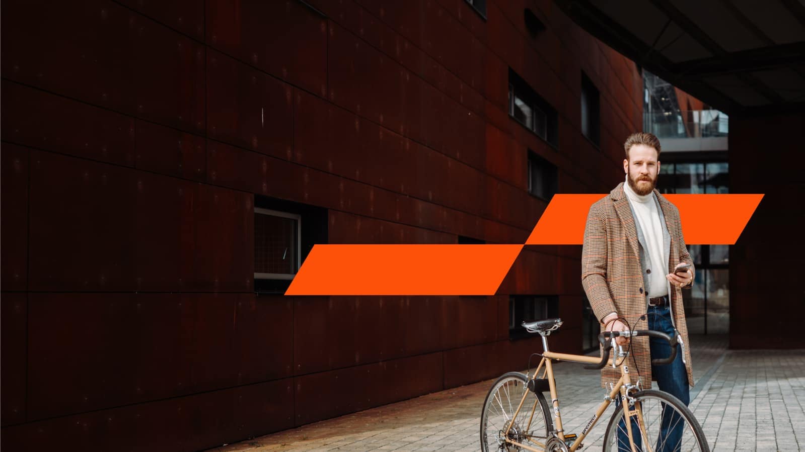 two ladies looking at an ipad standing infront of a feature wall