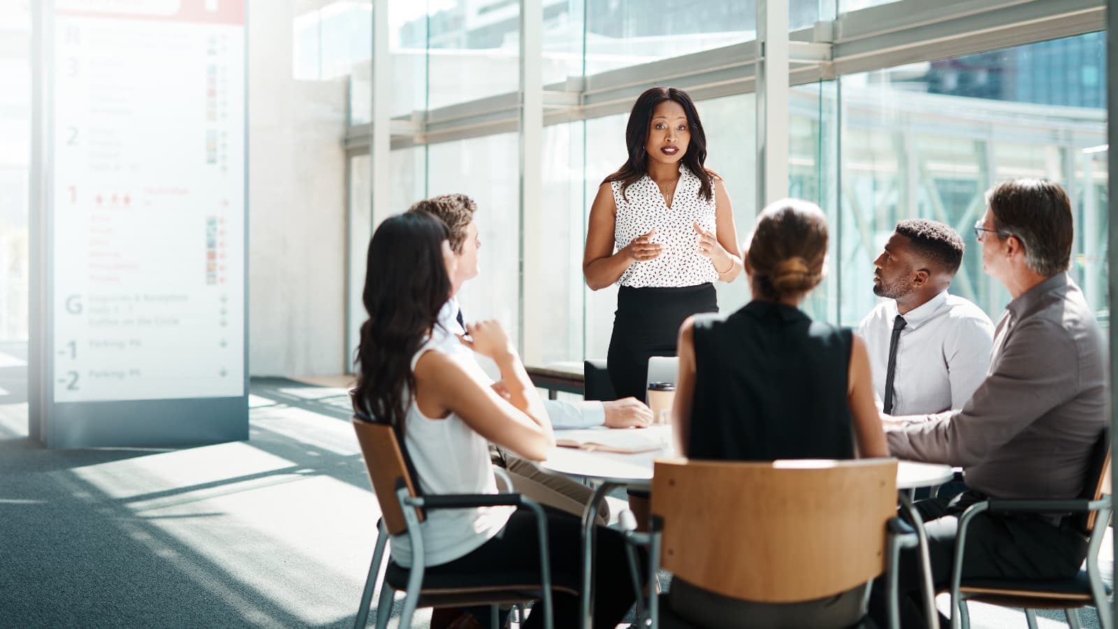 Group of colleagues talking around a table